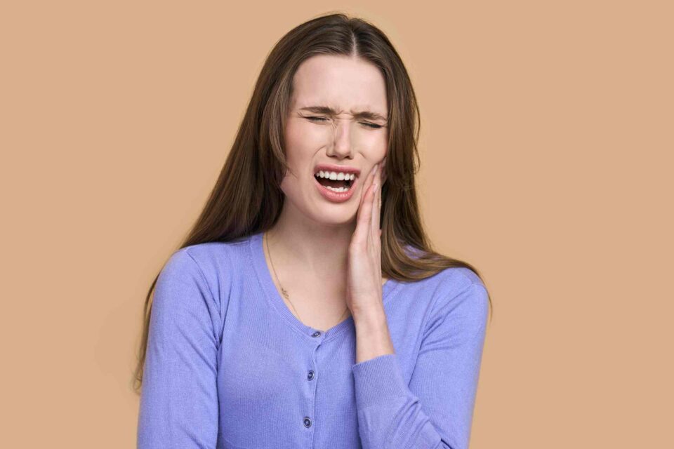 Patient with dental pain at Creve Coeur Dental for emergency care in Creve Coeur, MO.